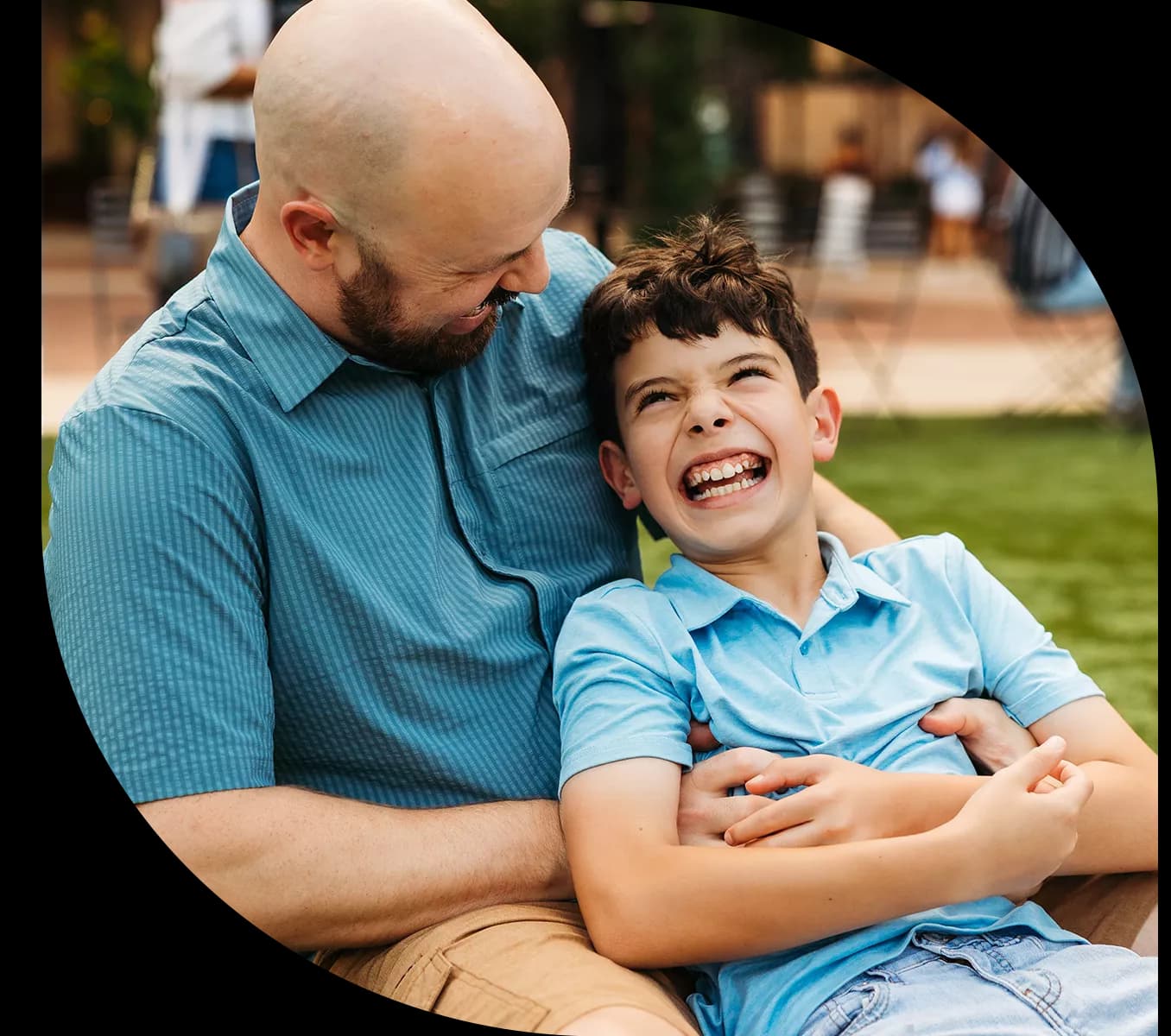 motif-shape-father-and-son-playing-at-park-vantage-bank