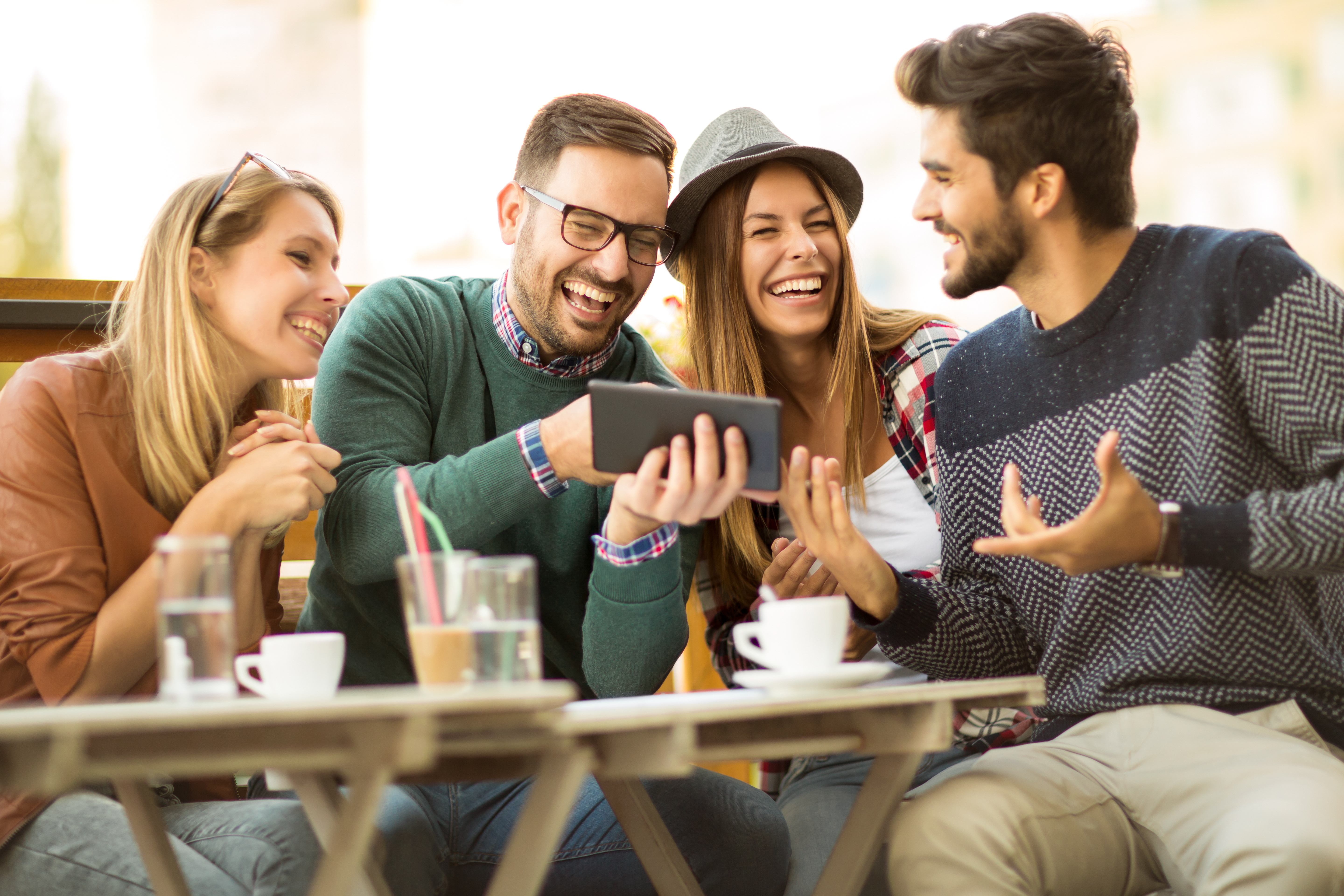 Group of friends looking at a phone