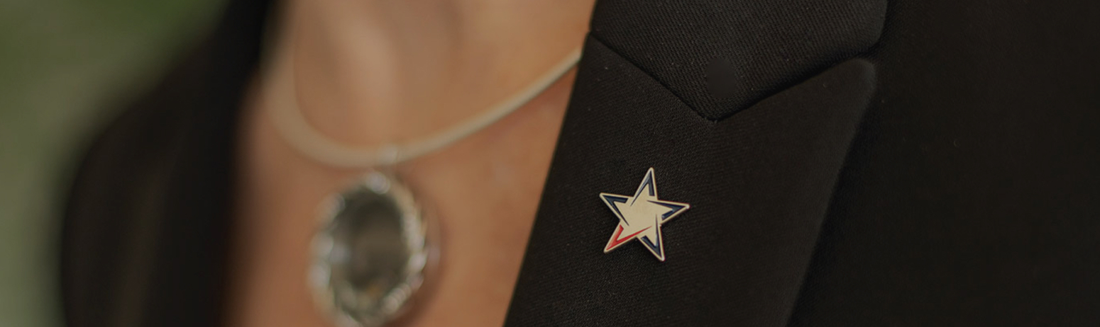 Vantage Bank lapel pin on bankers overcoat