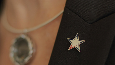 Vantage Bank lapel pin on bankers overcoat