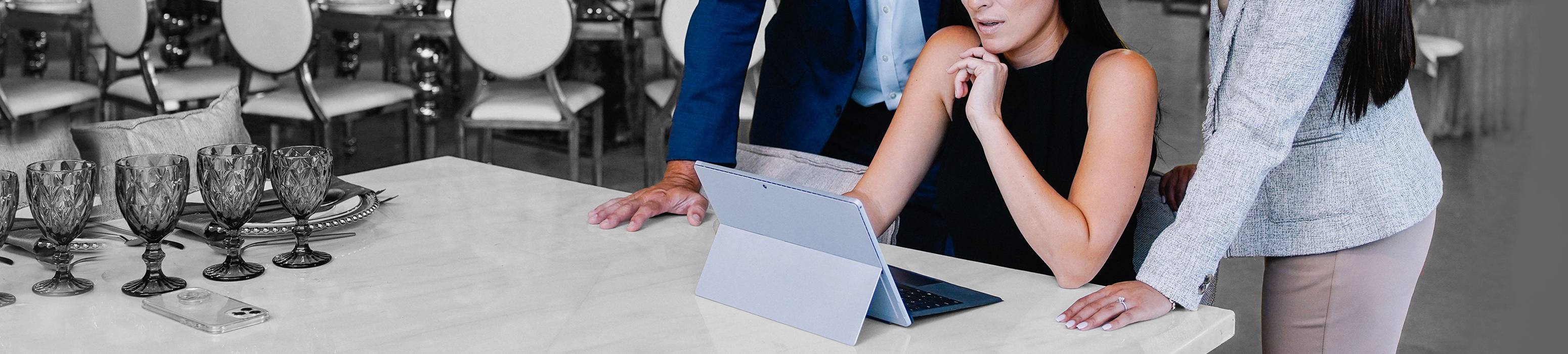 Images of workers looking on a screen