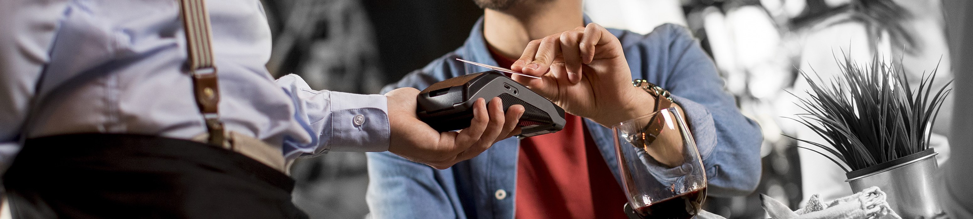 Customer swiping a credit card at a restaurant